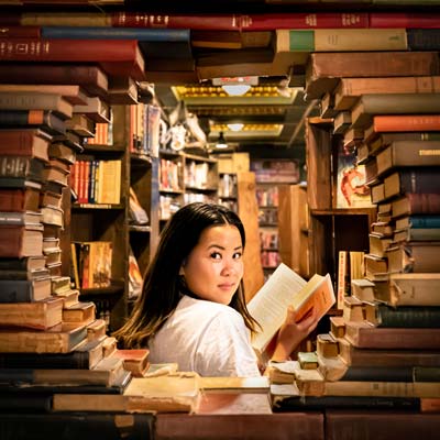 a woman with a book on her hand.